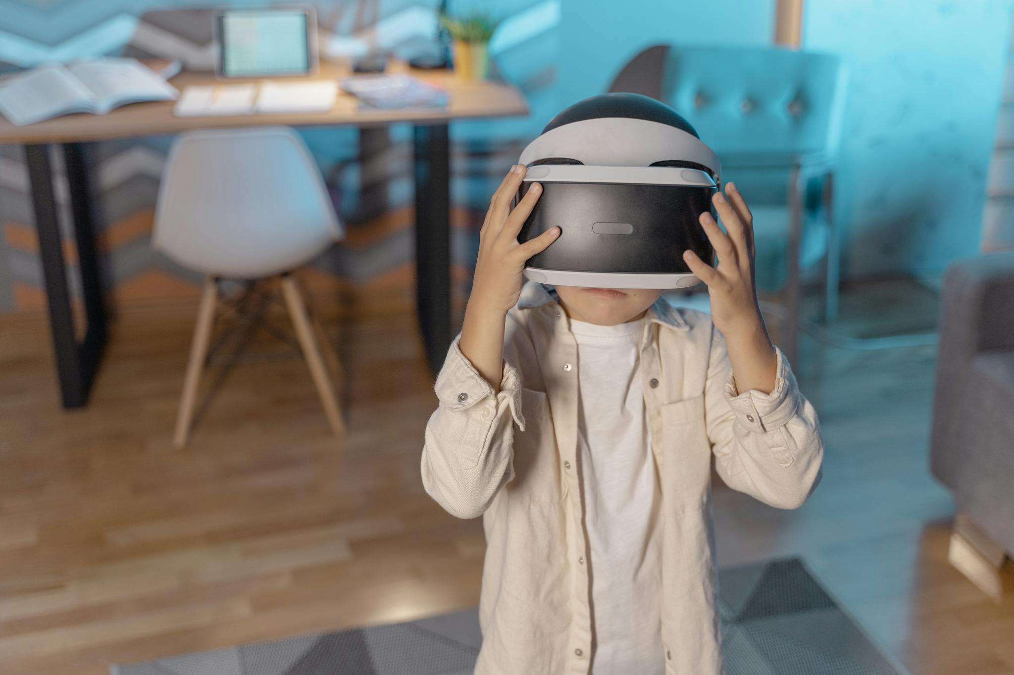 Young child immersed in virtual reality with VR headset indoors.